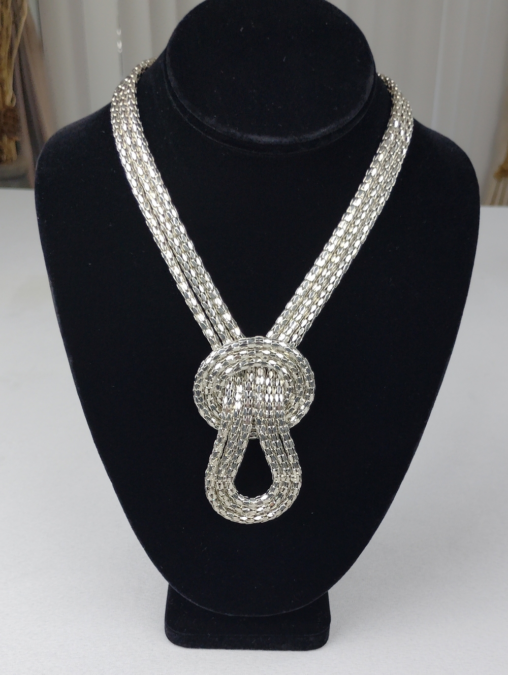 Silver Statement Knot Necklace .